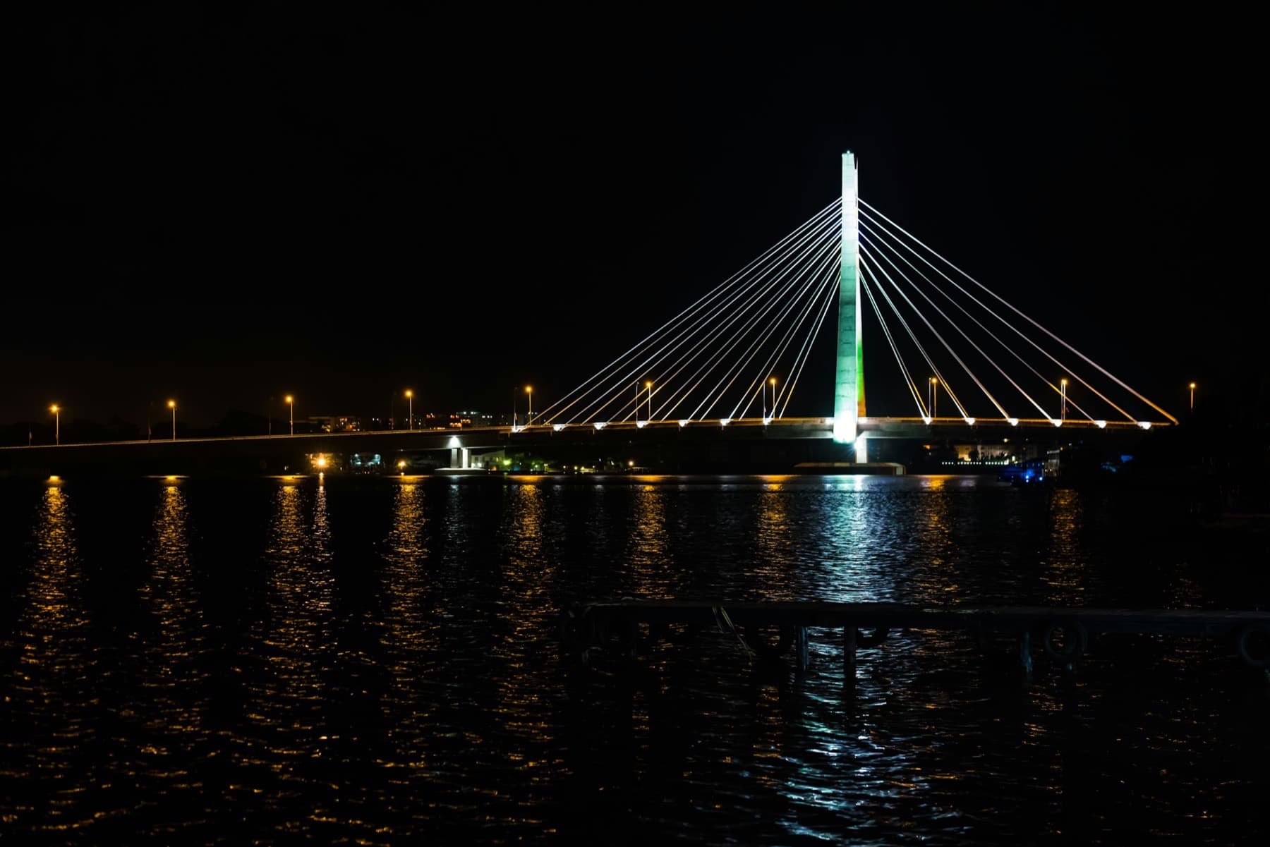Lekki-Ikoyi Link Bridge lit up at night over dark water